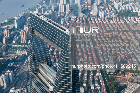 An aerial photo shows high-rise buildings along the Huangpu River in Lujiazui, Shanghai, China, on May 19, 2017. 