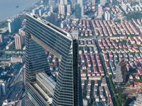 An aerial photo shows high-rise buildings along the Huangpu River in Lujiazui, Shanghai, China, on May 19, 2017. (