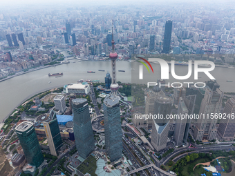 An aerial photo shows high-rise buildings along the Huangpu River in Lujiazui, Shanghai, China, on May 19, 2017. (