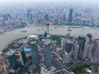 An aerial photo shows high-rise buildings along the Huangpu River in Lujiazui, Shanghai, China, on May 19, 2017. (