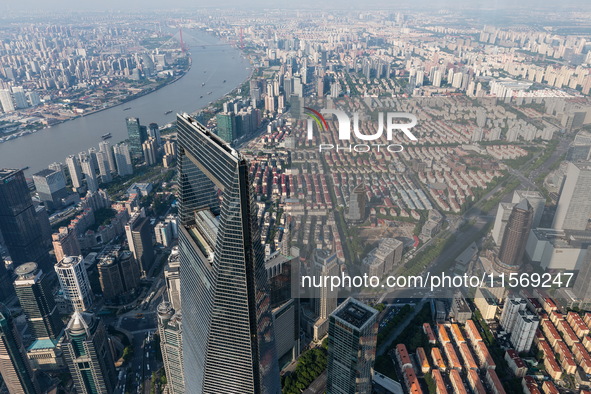 An aerial photo shows high-rise buildings along the Huangpu River in Lujiazui, Shanghai, China, on May 19, 2017. 