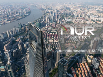 An aerial photo shows high-rise buildings along the Huangpu River in Lujiazui, Shanghai, China, on May 19, 2017. (