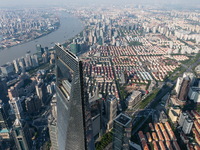 An aerial photo shows high-rise buildings along the Huangpu River in Lujiazui, Shanghai, China, on May 19, 2017. (