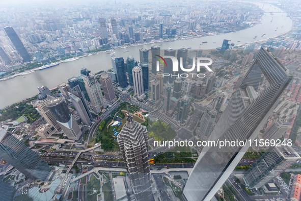 An aerial photo shows high-rise buildings along the Huangpu River in Lujiazui, Shanghai, China, on May 19, 2017. 