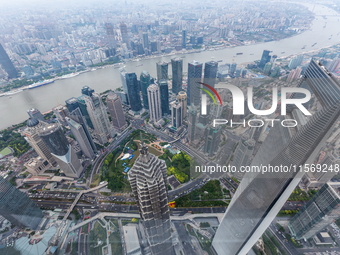 An aerial photo shows high-rise buildings along the Huangpu River in Lujiazui, Shanghai, China, on May 19, 2017. (