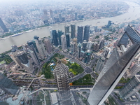 An aerial photo shows high-rise buildings along the Huangpu River in Lujiazui, Shanghai, China, on May 19, 2017. (