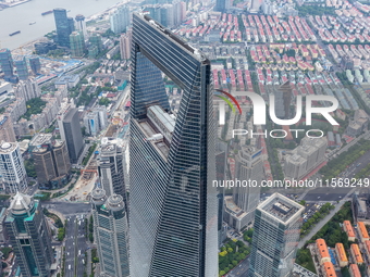 An aerial photo shows high-rise buildings along the Huangpu River in Lujiazui, Shanghai, China, on May 19, 2017. (