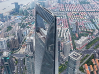 An aerial photo shows high-rise buildings along the Huangpu River in Lujiazui, Shanghai, China, on May 19, 2017. (