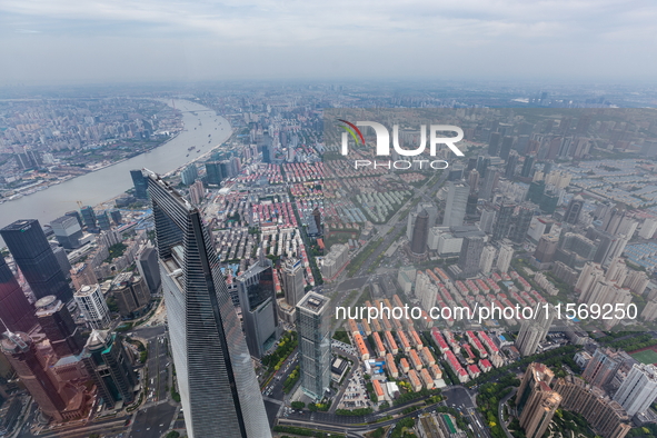 An aerial photo shows high-rise buildings along the Huangpu River in Lujiazui, Shanghai, China, on May 19, 2017. 