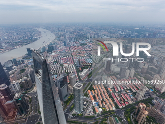 An aerial photo shows high-rise buildings along the Huangpu River in Lujiazui, Shanghai, China, on May 19, 2017. (