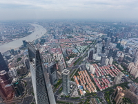 An aerial photo shows high-rise buildings along the Huangpu River in Lujiazui, Shanghai, China, on May 19, 2017. (