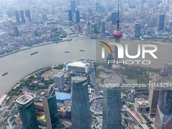 An aerial photo shows high-rise buildings along the Huangpu River in Lujiazui, Shanghai, China, on May 19, 2017. (