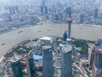 An aerial photo shows high-rise buildings along the Huangpu River in Lujiazui, Shanghai, China, on May 19, 2017. (