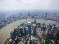 An aerial photo shows high-rise buildings along the Huangpu River in Lujiazui, Shanghai, China, on May 19, 2017. (