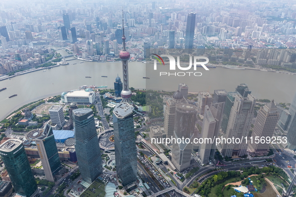 An aerial photo shows high-rise buildings along the Huangpu River in Lujiazui, Shanghai, China, on May 19, 2017. 