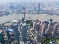 An aerial photo shows high-rise buildings along the Huangpu River in Lujiazui, Shanghai, China, on May 19, 2017. (