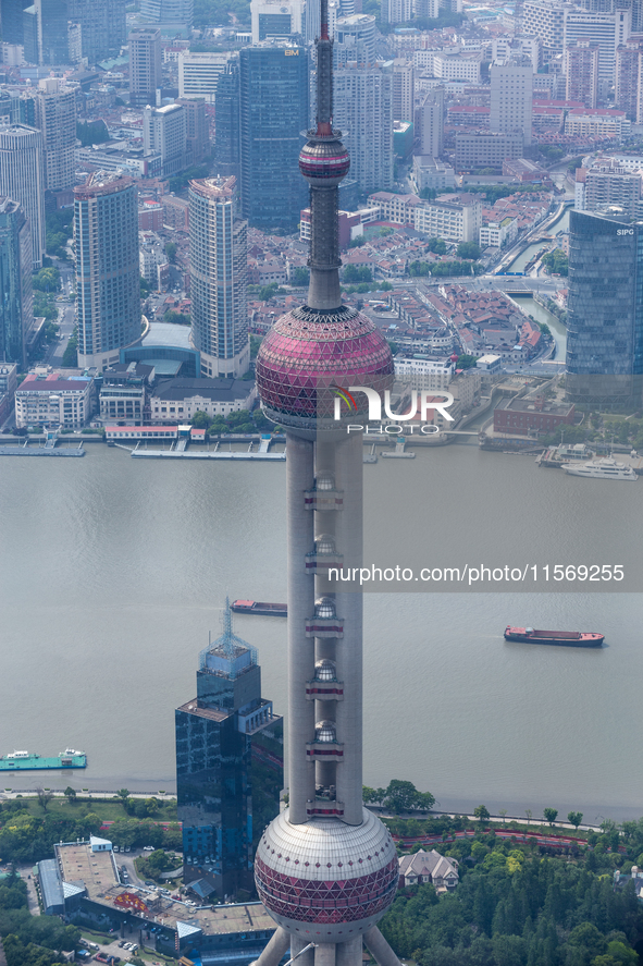 An aerial photo shows high-rise buildings along the Huangpu River in Lujiazui, Shanghai, China, on May 19, 2017. 