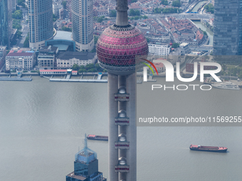 An aerial photo shows high-rise buildings along the Huangpu River in Lujiazui, Shanghai, China, on May 19, 2017. (