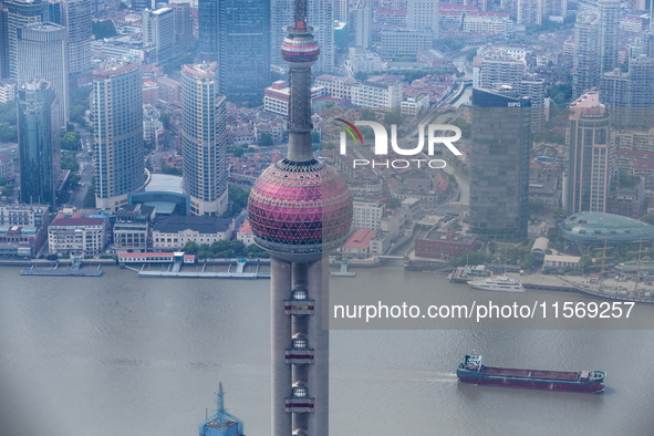 An aerial photo shows high-rise buildings along the Huangpu River in Lujiazui, Shanghai, China, on May 19, 2017. 