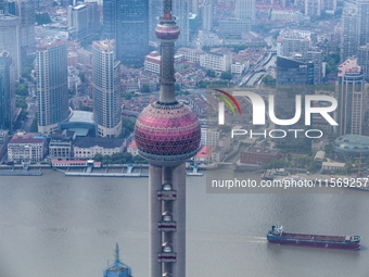 An aerial photo shows high-rise buildings along the Huangpu River in Lujiazui, Shanghai, China, on May 19, 2017. (