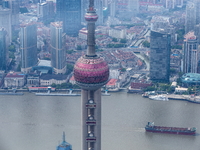 An aerial photo shows high-rise buildings along the Huangpu River in Lujiazui, Shanghai, China, on May 19, 2017. (