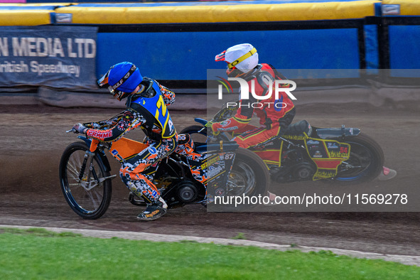 Mickie Simpson of the Sheffield Tiger Cubs in blue rides inside Max James, the guest rider for the Belle Vue Colts in white, during the WSRA...