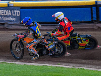 Mickie Simpson of the Sheffield Tiger Cubs in blue rides inside Max James, the guest rider for the Belle Vue Colts in white, during the WSRA...