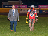 Belle Vue Colts' guest rider Max James (left) walks back to the pits with the Clerk of the Course, Neville Stanley, after his fall during th...