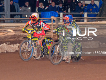 Sheffield Tiger Cubs' Ace Pijper in blue rides inside Belle Vue Colts' guest rider Max James in white during the WSRA National Development L...