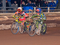 Sheffield Tiger Cubs' Ace Pijper in blue rides inside Belle Vue Colts' guest rider Max James in white during the WSRA National Development L...