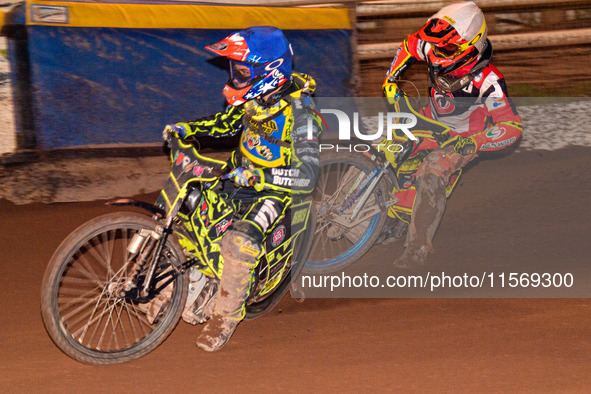 Sheffield Tiger Cubs' Ace Pijper in blue rides inside Belle Vue Colts' guest rider Max James in white during the WSRA National Development L...