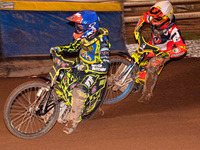 Sheffield Tiger Cubs' Ace Pijper in blue rides inside Belle Vue Colts' guest rider Max James in white during the WSRA National Development L...