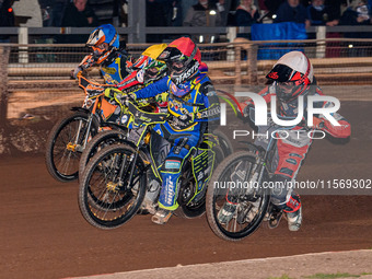 Belle Vue Colts' Freddy Hodder in white rides inside Sheffield Tiger Cubs' Nathan Ablitt in red, Belle Vue Colts' William Cairns in yellow,...