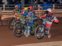 Belle Vue Colts' Freddy Hodder in white rides inside Sheffield Tiger Cubs' Nathan Ablitt in red, Belle Vue Colts' William Cairns in yellow,...