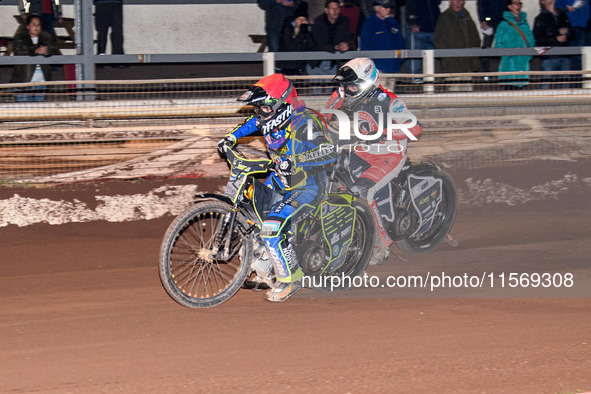 Nathan Ablitt of Sheffield Tiger Cubs in red leads Matt Marson of Belle Vue Colts in white during the WSRA National Development League match...