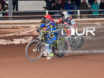 Nathan Ablitt of Sheffield Tiger Cubs in red leads Matt Marson of Belle Vue Colts in white during the WSRA National Development League match...