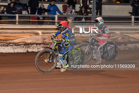 Nathan Ablitt of Sheffield Tiger Cubs in red leads Matt Marson of Belle Vue Colts in white during the WSRA National Development League match...