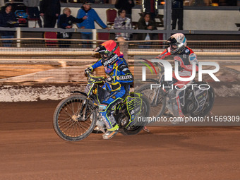 Nathan Ablitt of Sheffield Tiger Cubs in red leads Matt Marson of Belle Vue Colts in white during the WSRA National Development League match...