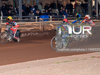 Nathan Ablitt of Sheffield Tiger Cubs in red leads Max James, guest rider for Belle Vue Colts, in white, Luke Harrison of Sheffield Tiger Cu...