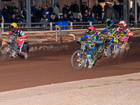 Nathan Ablitt of Sheffield Tiger Cubs in red leads Max James, guest rider for Belle Vue Colts, in white, Luke Harrison of Sheffield Tiger Cu...