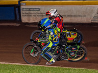 Sheffield Tiger Cubs' Luke Harrison in blue rides inside Belle Vue Colts' guest rider Max James in red during the WSRA National Development...