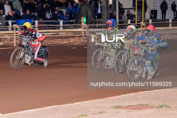 Nathan Ablitt of the Sheffield Tiger Cubs in Red rides inside William Cairns of the Belle Vue Colts in White, with Ace Pijper of the Sheffie...