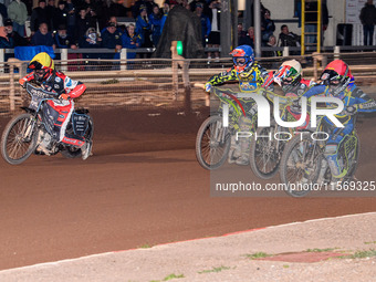 Nathan Ablitt of the Sheffield Tiger Cubs in Red rides inside William Cairns of the Belle Vue Colts in White, with Ace Pijper of the Sheffie...