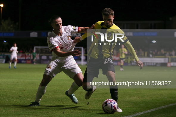 Harrogate Town's Josh March holds off Doncaster Rovers's Jamie Sterry during the Sky Bet League 2 match between Harrogate Town and Doncaster...