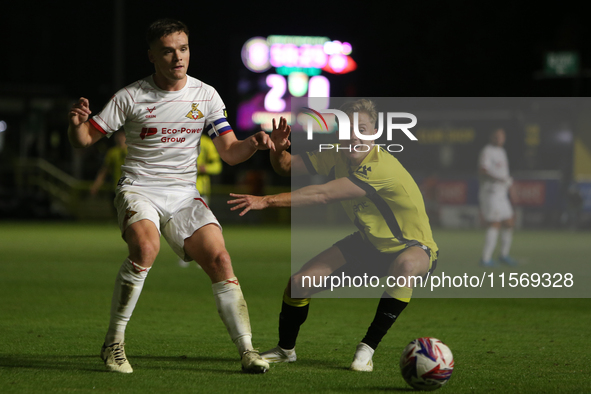 Owen Bailey of Doncaster Rovers makes a pass under pressure during the Sky Bet League 2 match between Harrogate Town and Doncaster Rovers at...