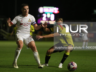 Owen Bailey of Doncaster Rovers makes a pass under pressure during the Sky Bet League 2 match between Harrogate Town and Doncaster Rovers at...