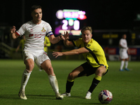 Owen Bailey of Doncaster Rovers makes a pass under pressure during the Sky Bet League 2 match between Harrogate Town and Doncaster Rovers at...