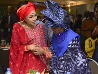 L-R: Minister of Art, Culture, and Creative Economy, Hannatu Musa Musawa, and Founder, Nike Art Gallery, Chief Nike Davies-Okundaye, exchang...