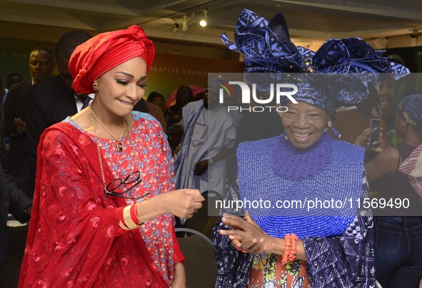 L-R: Minister of Art, Culture, and Creative Economy, Hannatu Musa Musawa, and Founder, Nike Art Gallery, Chief Nike Davies-Okundaye, exchang...