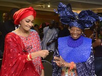 L-R: Minister of Art, Culture, and Creative Economy, Hannatu Musa Musawa, and Founder, Nike Art Gallery, Chief Nike Davies-Okundaye, exchang...